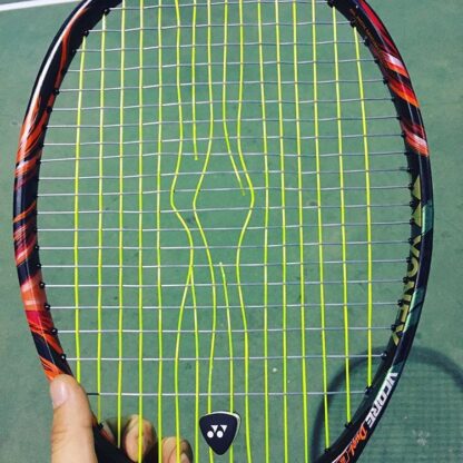 Broken hybrid tennis string.