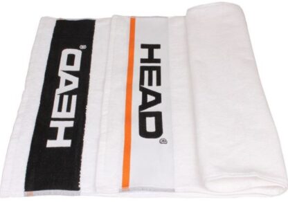 White towel with orange details and HEAD in black writing on each end.