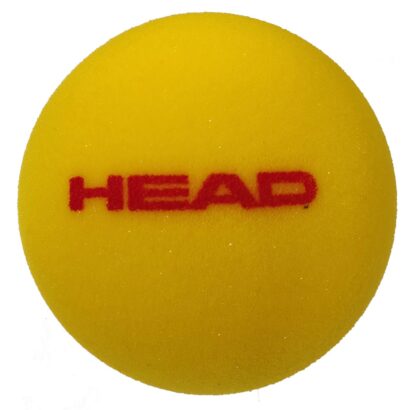 Yellow foam ball from HEAD with HEAD in red writing. 9 cm.