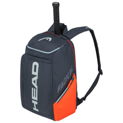 Tennis bag in grey with orange details on side and radical in grey writing on side. HEAD in grey writing down the middle and grey HEAD logo on the top of the bag.