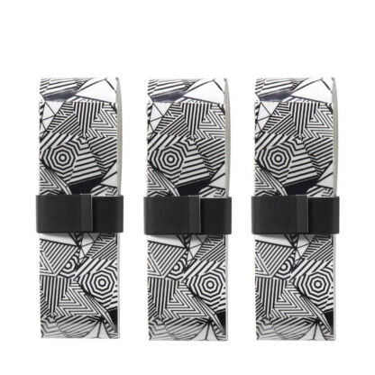 Close up of three black and white overgrips in dazzle pattern