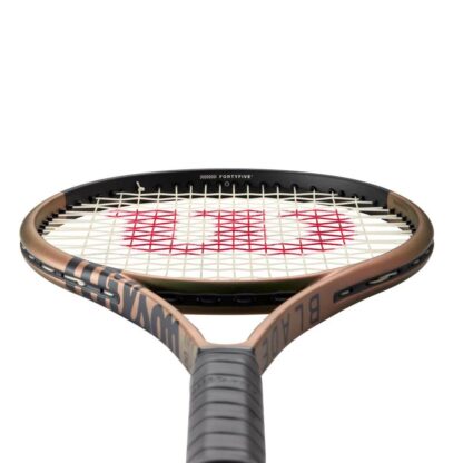 View from grip of green/brown iridescent tennis racquet with black top and black grip. Wilson Blade 100L v8.0.