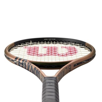 View from grip of green/brown iridescent tennis racquet with black top and black grip. Wilson Blade 100UL v8.0.