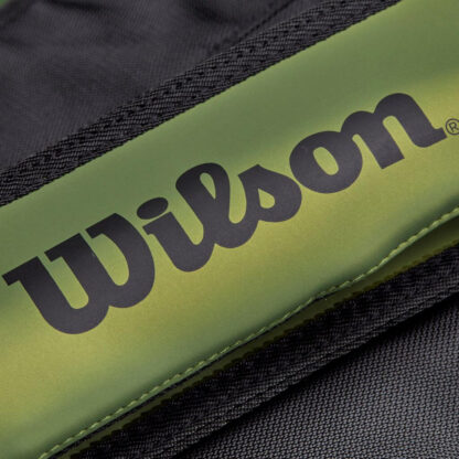 Black and olive racquet bag from Wilson. With space for 9 racquets. Wilson in black writing on the shoulder straps.