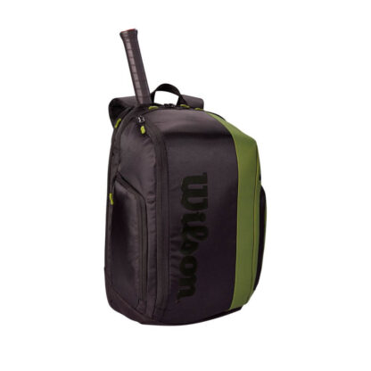 Black and olive racquet backpack from Wilson. Wilson logo in black writing on front. Racquet handle sticking out from top of the bag.