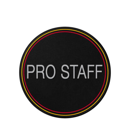 Dampener for tennis in black with grey "Pro Staff" text. Yellow and red ring at the border of the dampener. Made for the Wilson Pro Staff racquet.