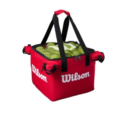 Side view of square bag for tennis balls from Wilson in red. Black mesh on the top with white Wilson logo. Wilson in white writing on the sides of the bag.