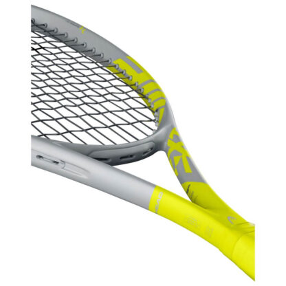 Side view of the throat of grey and yellow tennis racquet from HEAD. Grey strings with black HEAD logo and yellow grip. HEAD in yellow writing on the inside of the beam. Extreme in yellow written on the beam from the throat to the middle of the racquet head. HEAD Extreme MP Graphene 360+.