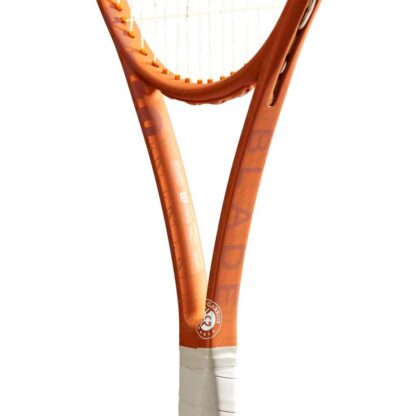 Close up throat view of orange tennis racquet with grey grip and white strings with red "W" for Wilson. White Roland Garros logo at the bottom of the throat. Wilson Blade 98 18x20 v8.0 Roland Garros Edition. Blade in orange writing on the side of the beam.