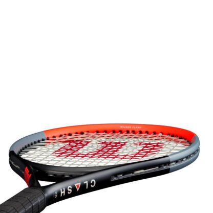 Side throat view of infrared, grey and black tennis racquet with white strings and red Wilson logo on the strings. black grip. Wilson Clash 26 v1.0.