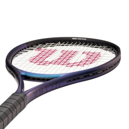 Side throat view of blue matte tennis racquet with black top, white strings with red logo and black grip. Wilson Ultra 100 v4.0. Ultra in black writing on the side.