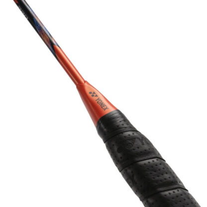 Cap of black and orange badminton racquet from Yonex. Orange Energy Boost Plus Cap with Yonex and Yonex logo i black writing. Black grip. Yonex Astrox 77 Pro High Orange.