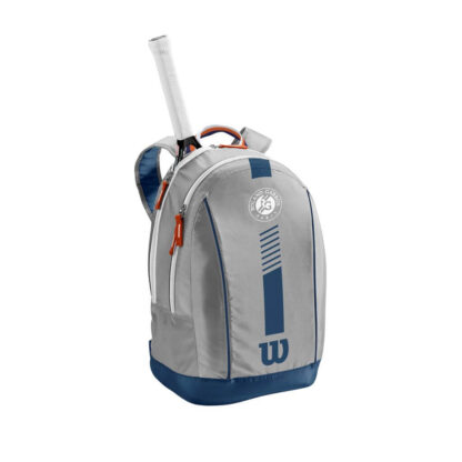 Grey backpack with blue and clay details. White Roland Garros logo and blue Wilson logo on the front. Wilson Roland Garros Jr Backpack. Tennis Racquet sticking up from the compartment closet to the back.