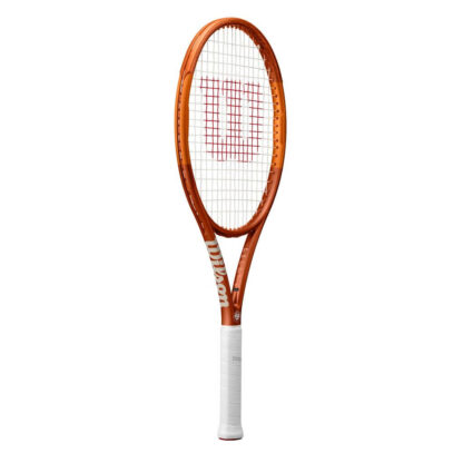 Side view of orange tennis racquet with white grip. White Roland Garros logo at the bottom of the throat. Wilson in gold writing at the side of the throat. Wilson Roland Garros Team 102