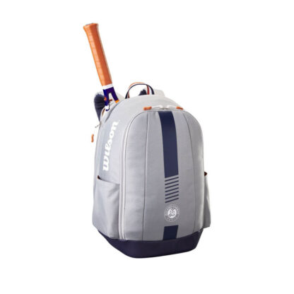 grey backpack with blue and clay details. White Roland Garros logo. Wilson Roland Garros Team Backpack. Tennis Racquet sticking up from the compartment closet to the back.