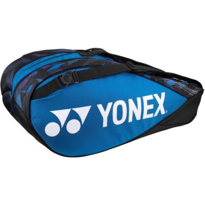 Blue racquet bag from Yonex. Racquet bag for 6 racquets. Yonex in white writing along white Yonex logo. Details in black and different shades of blue.