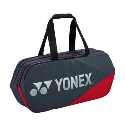 Rectangular greyish pearl/silver grey and red racquet bag from Yonex. Yonex in silver writing with silver Yonex logo.