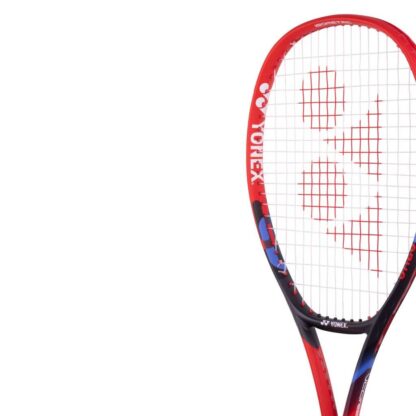 Close up of red, black and blue tennis racquet from Yonex. Vcore in white writing on the side. Yonex Vcore 26 2023 model.