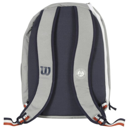 Wilson Roland Garros Grey junior backpack with blue and clay details. Back side view showing back side in blue and straps in grey with blue "W" (Wilson) logo on one strip and white Roland Garros logo on the other strip.