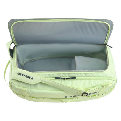 Lime/ light green duffle bag from HEAD with HEAD branding detail. Shown open where the compartment is empty.
