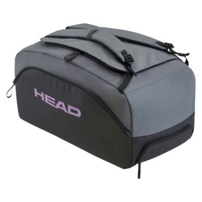 Black and grey duffle bag from HEAD. With purple HEAD branding on the side. Adjustable shoulder straps in grey. Multiple compartments - side, bottom and one big on the top.