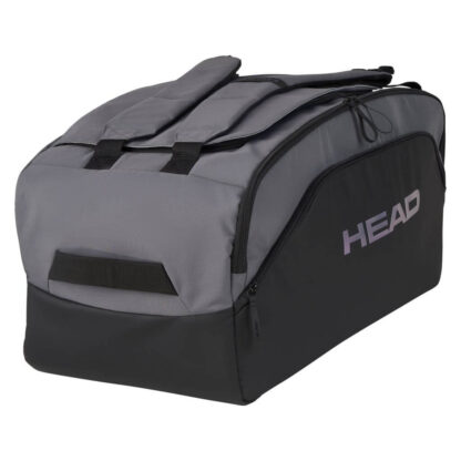 Black and grey duffle bag from HEAD. With purple HEAD branding on the side. Adjustable shoulder straps in grey. Multiple compartments - side, bottom and one big on the top. Also with strap on the top, to carry the bag in one hand.